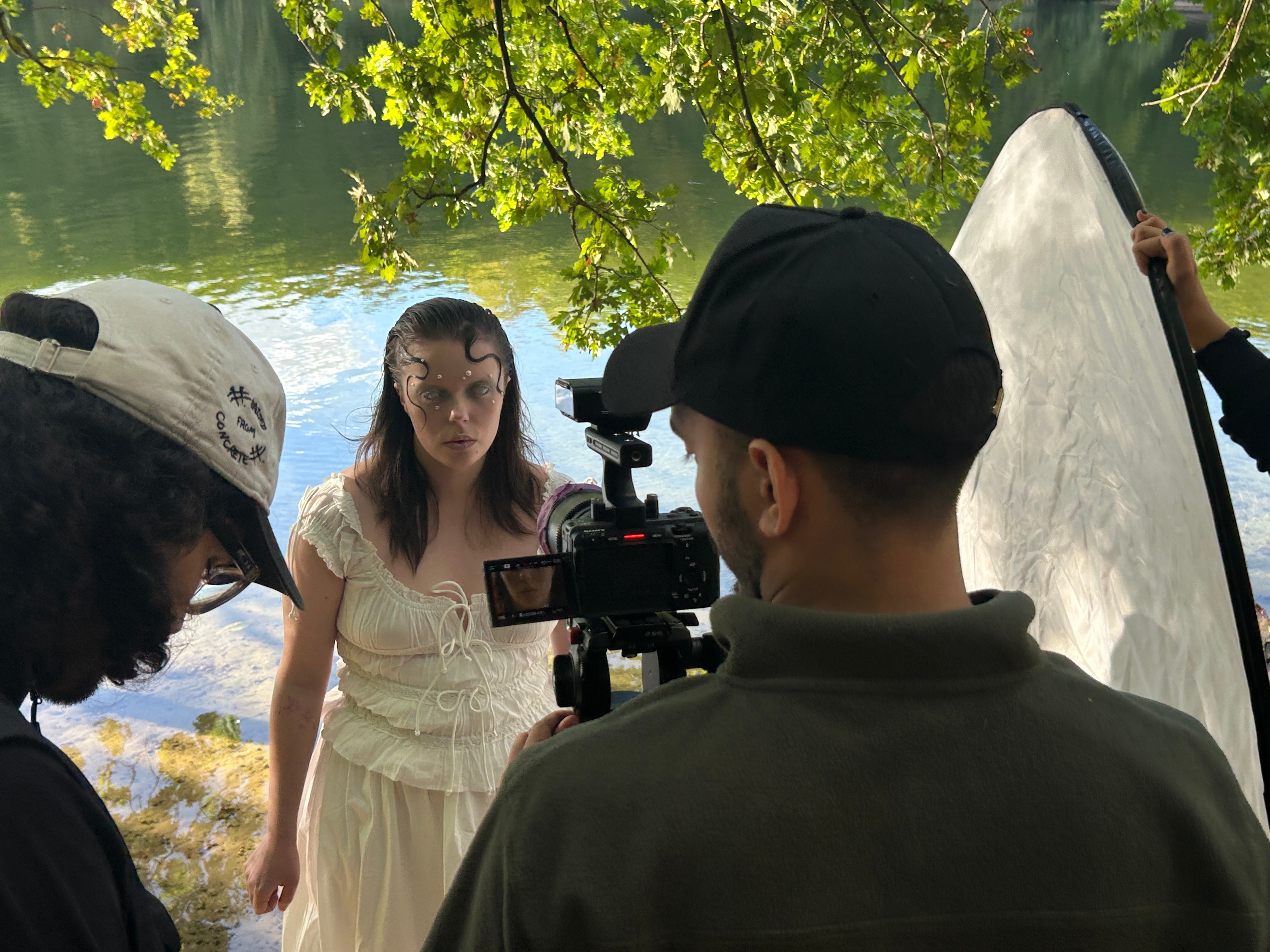 picture with a camera pointed towards person in siren makeup